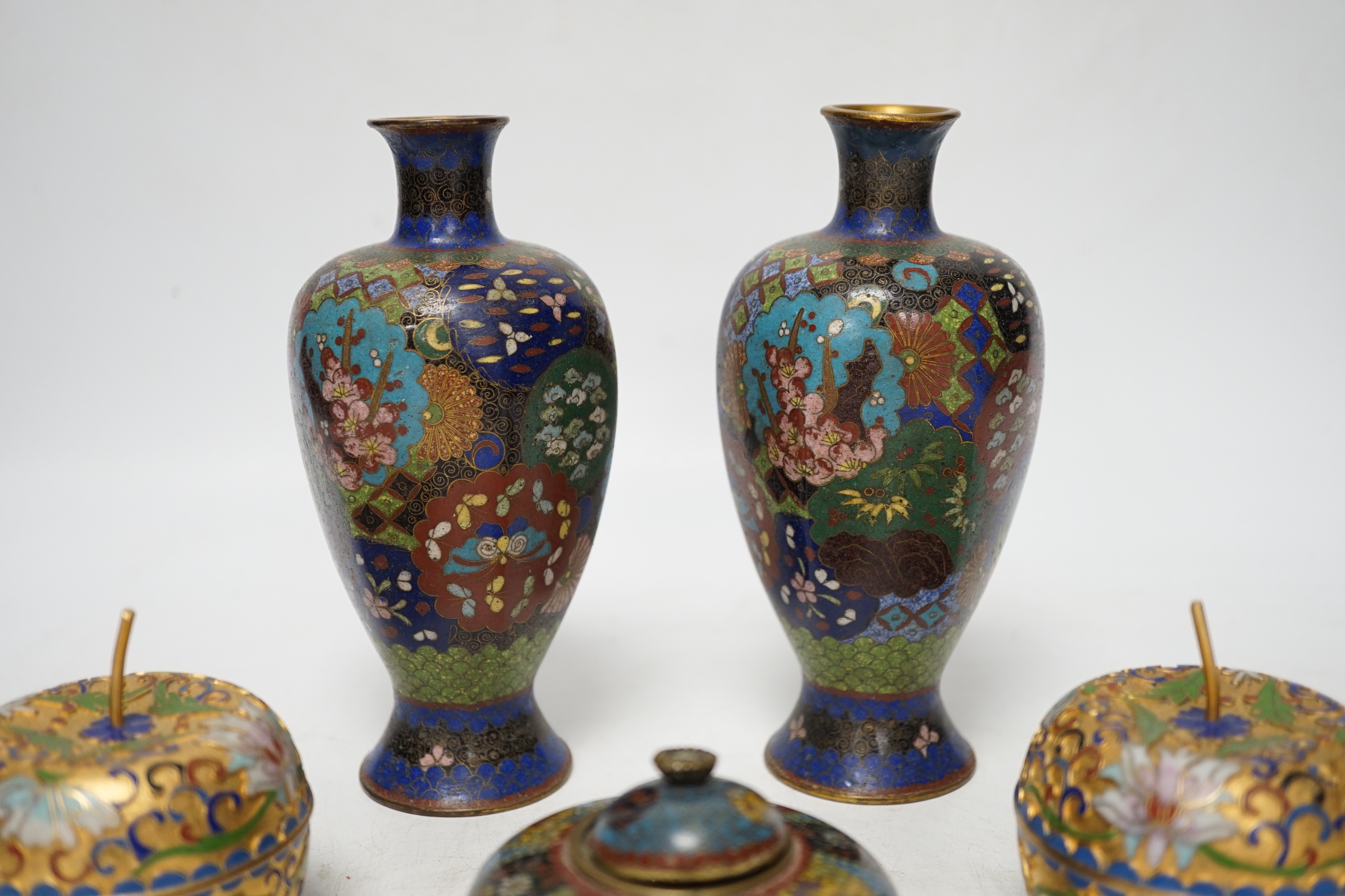 A pair of Chinese cloisonné enamel vases, similar Meiji period Japanese pot and cover and a pair of champleve ‘Apple’ boxes and covers, tallest 15cm